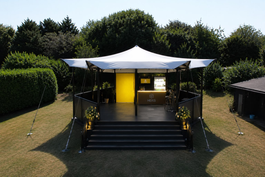 Single story hospitality venue with white tenting