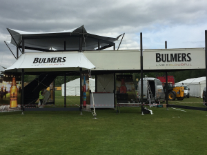 bulmers-branded-structure-build-in-progress Bulmers branded two-storey exhibition structure under construction with 'Live Colourful' signage