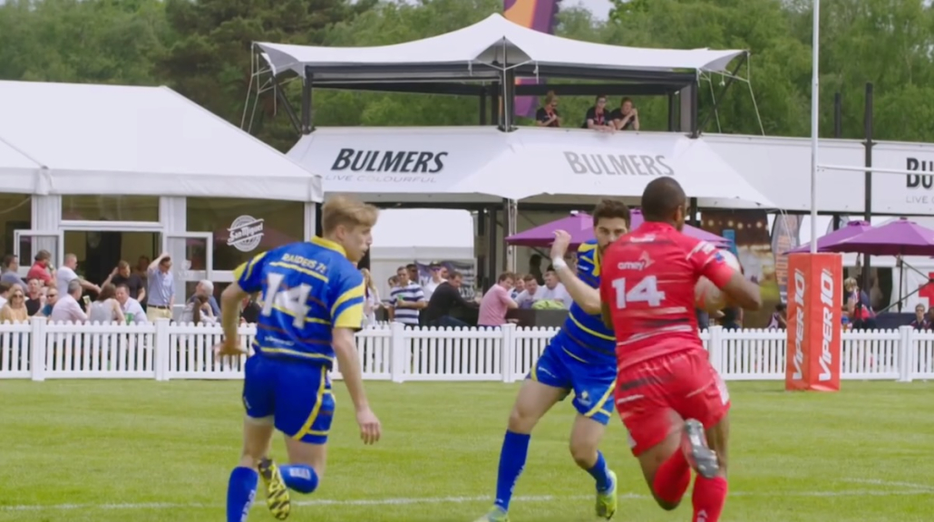 bulmers-hospitality-structure-rugby-match-view Bulmers branded hospitality structure with guests watching a rugby match pitch-side