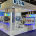 Eaton branded indoor exhibition stand with white display units, LED lighting and product wall