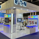 Eaton branded indoor exhibition stand with white display units, LED lighting and product wall
