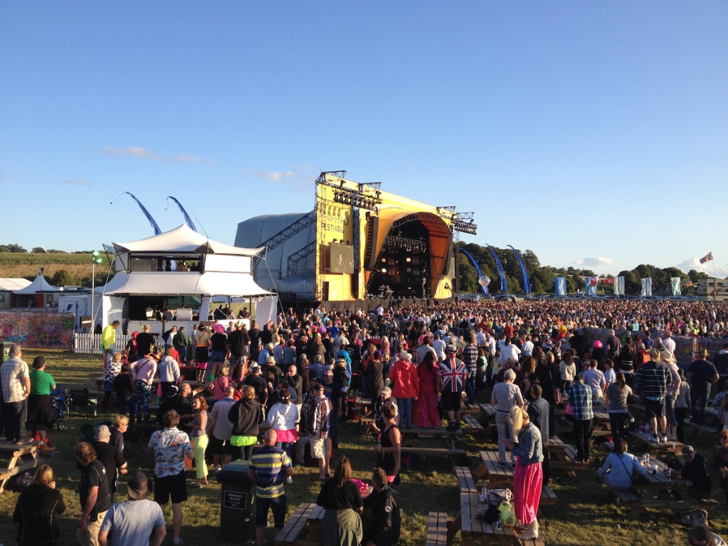 festival-vip-viewing-structure-main-stage-crowd Elevated VIP viewing structure overlooking a festival main stage and crowd