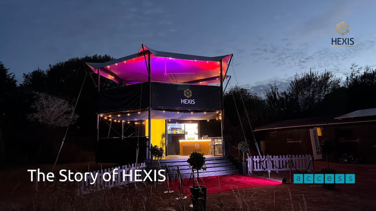 hexis-elevated-hospitality-structure-night HEXIS elevated hospitality structure illuminated at night with red carpet entrance.