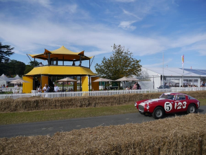 HEXIS Sky Lounge hospitality structure overlooking a historic motorsport event with elevated guest viewing