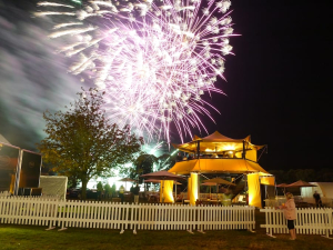 HEXIS Sky Lounge hospitality structure overlooking a historic event with elevated guest viewing