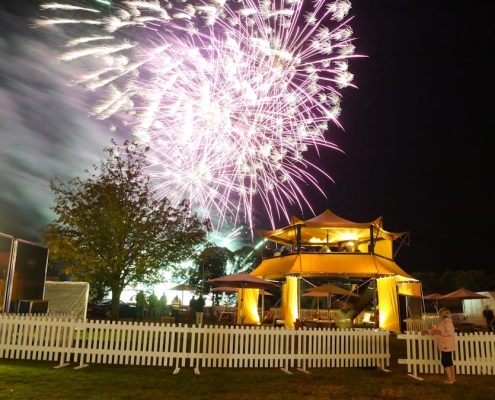 HEXIS Sky Lounge hospitality structure overlooking a historic event with elevated guest viewing