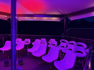 hexis-upper-deck-purple-lounge-seating-night HEXIS upper deck lounge seating bathed in purple and pink ambient lighting at night