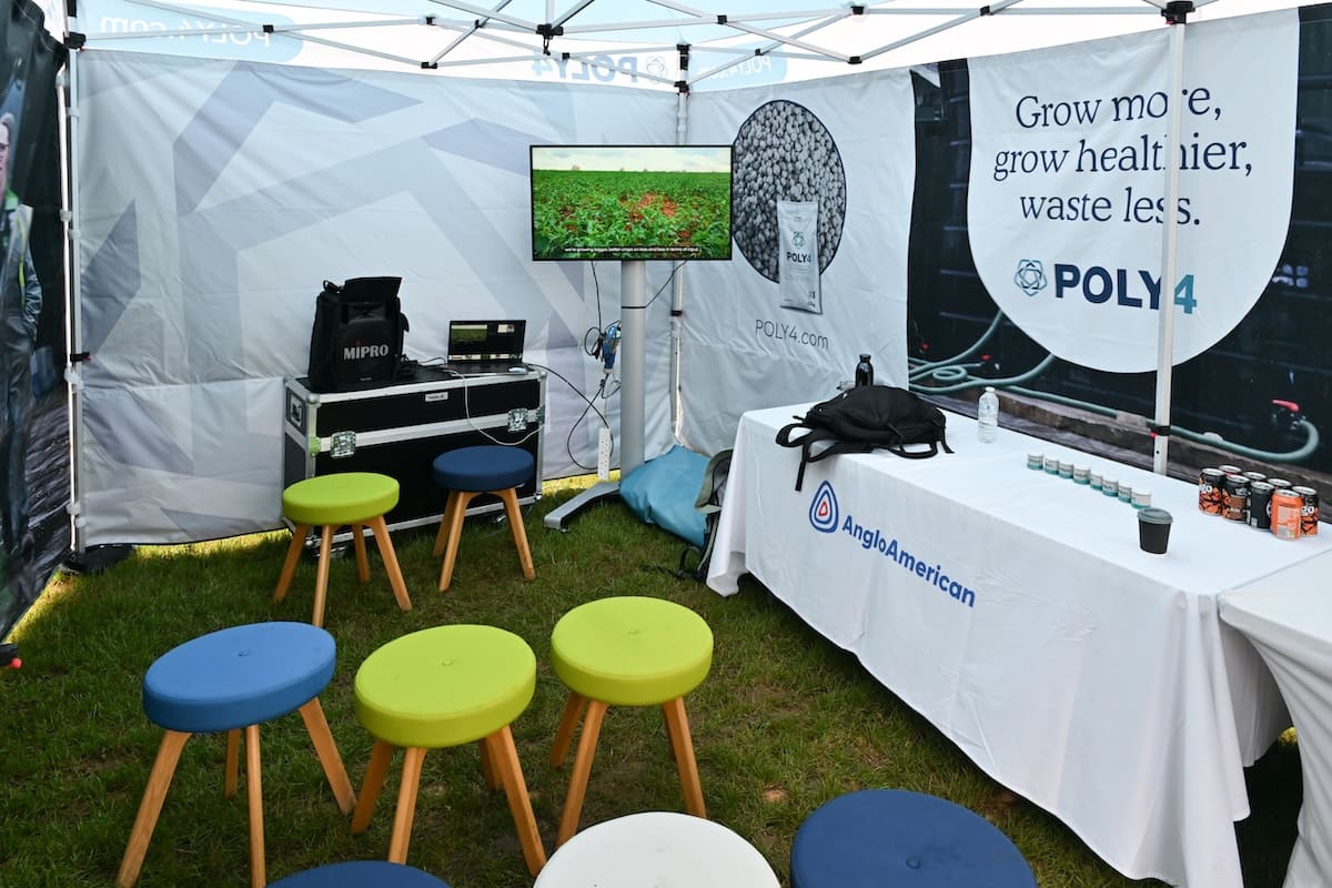 poly4-anglo-american-gazebo-interior-seating Interior of the Poly4 AngloAmerican gazebo stand with branded stools, screen display and refreshments table.