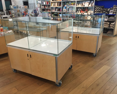wooden-glass-display-cases-mobile-shop-counters Wooden glass display cases on lockable castors used as retail counters in a gift shop